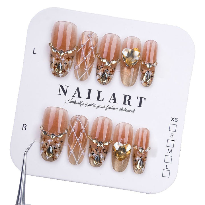 Artificial nails with glitter and heart accents Stornfield