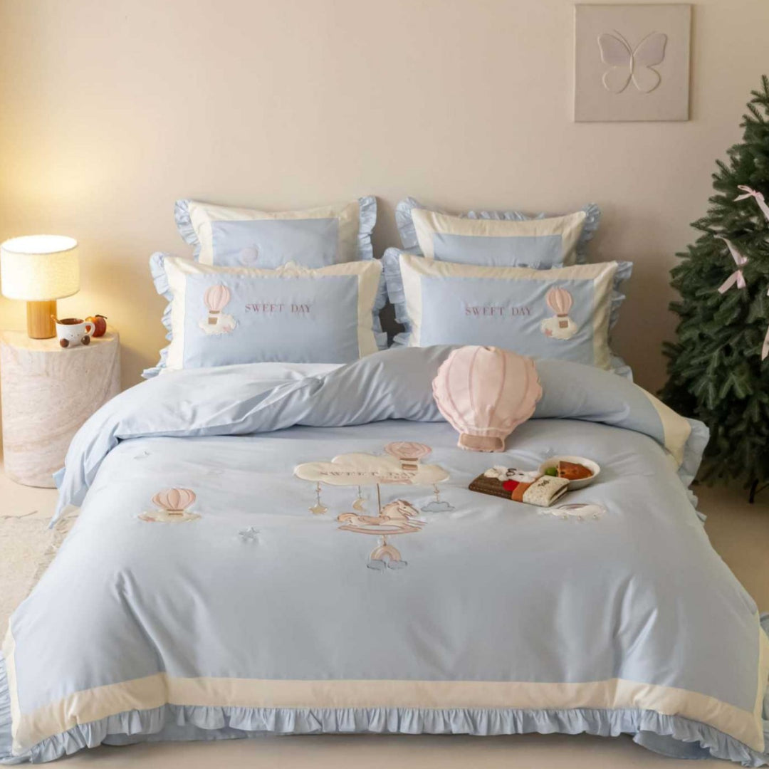 Bedding set in vintage girl style with ruffled hem, hot air balloon applique, and extra soft satin