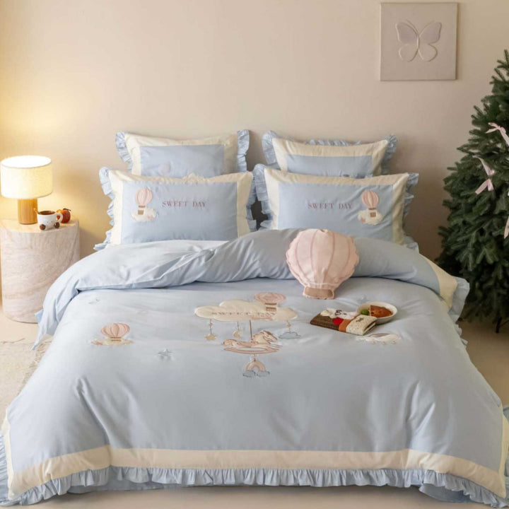 Bedding set in vintage girl style with ruffled hem, hot air balloon applique, and extra soft satin