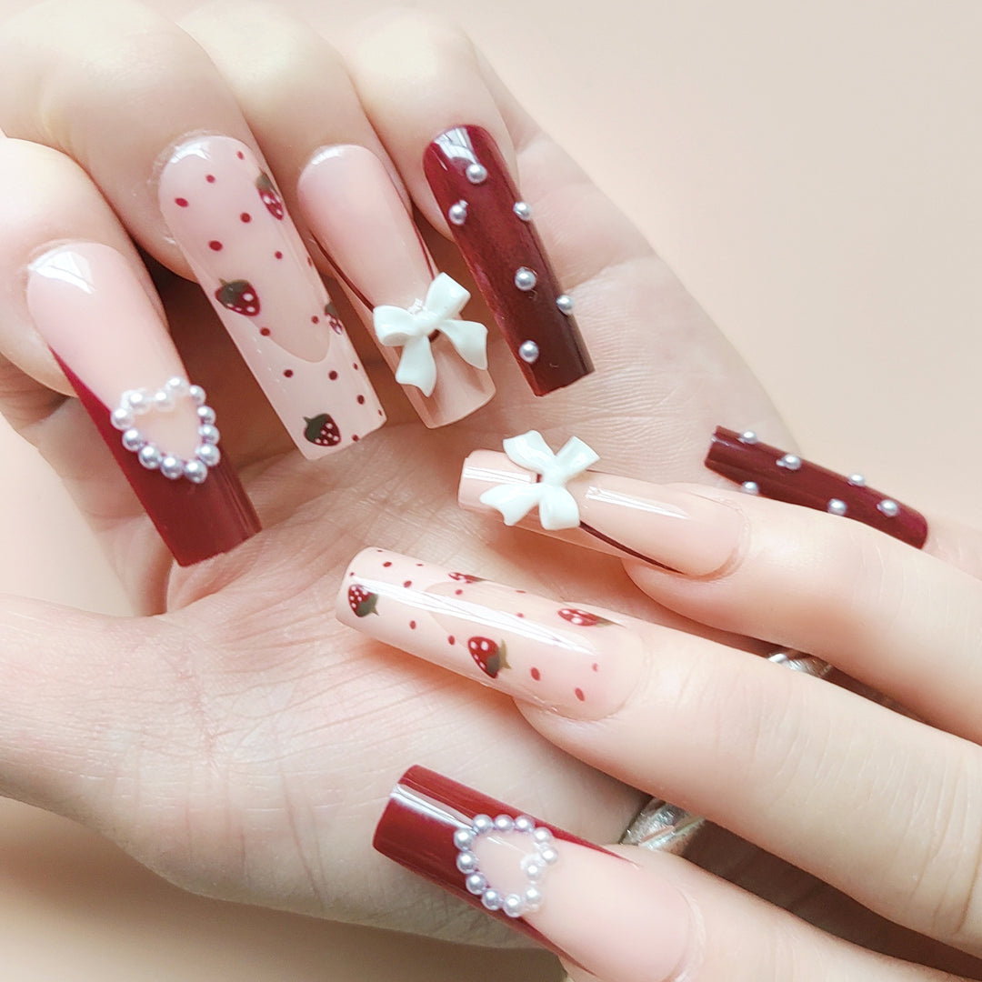Artificial artificial nails with heart designs and holographic accents Stornfield