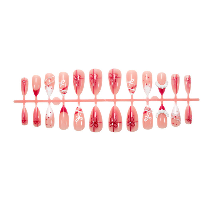 Nail set with glamorous bows and elegant pearl embellishments Stornfield