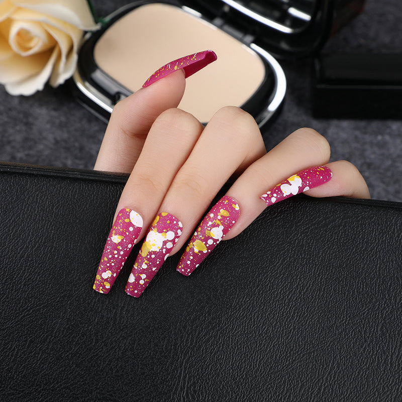 Artistic splatter design artificial nails Stornfield