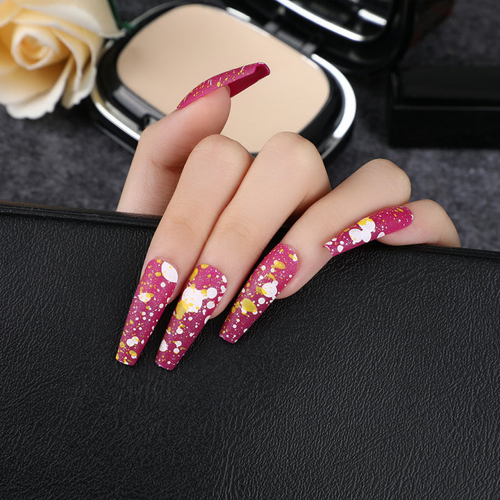 Artistic splatter design artificial nails Stornfield