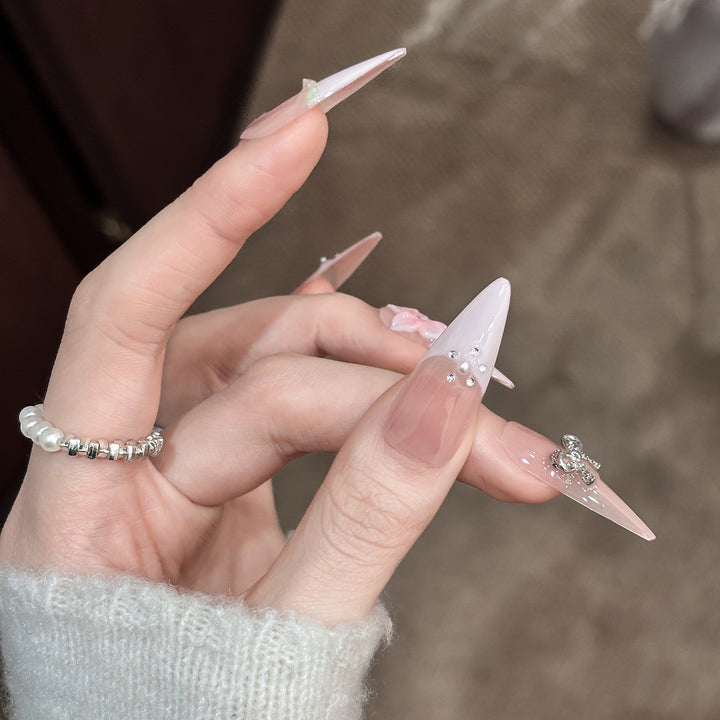 Decorative Stiletto Press-On Nails with Floral Accents and Gem Details