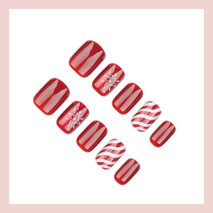 Artificial nail set with festive winter motifs and glitter accents Stornfield