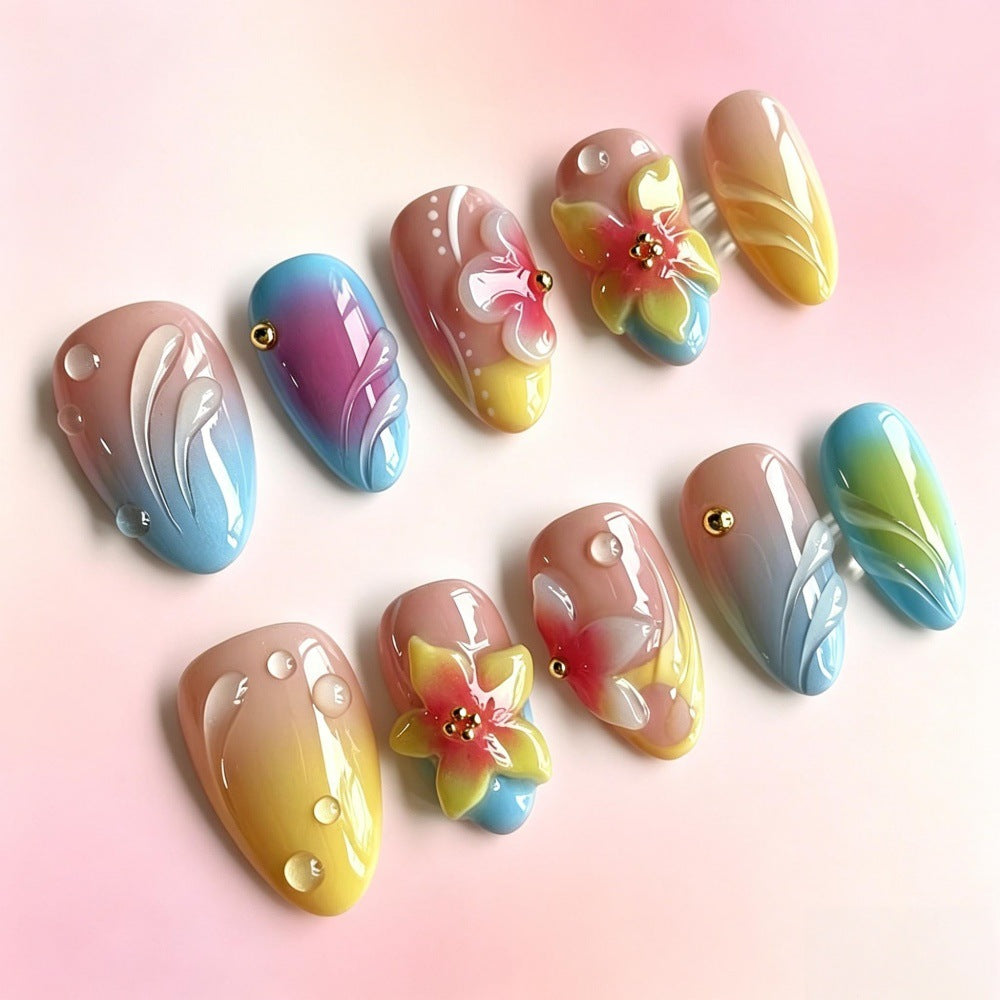Acrylic nail set with floral elements and colorful accents Stornfield