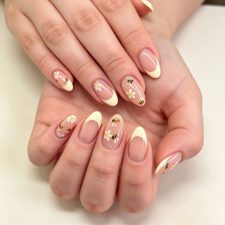 Artificial nails with elegant French tip and floral accents Stornfield