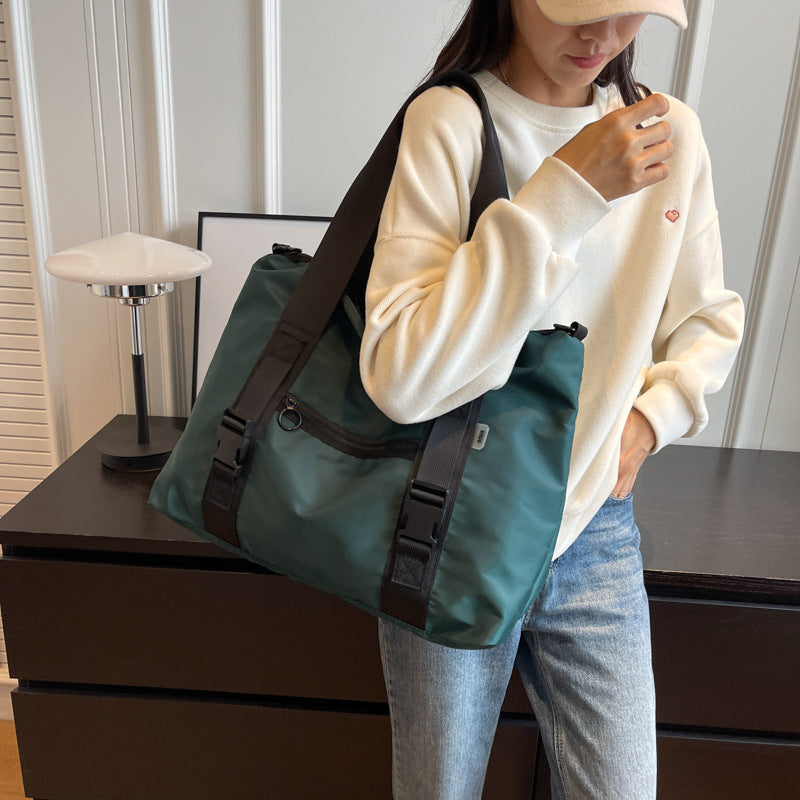 Spacious sports duffel bag with ergonomic carrying handles and water-repellent material Stornfield