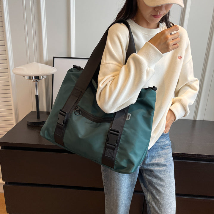 Spacious sports duffel bag with ergonomic carrying handles and water-repellent material Stornfield