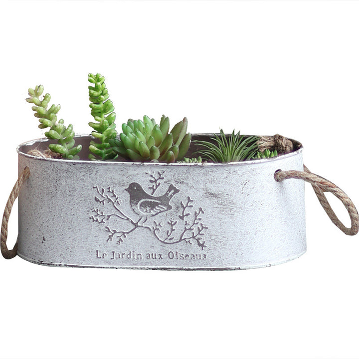 Decorative storage basket made of metal with natural design Stornfield
