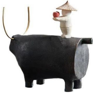 Decorative Angel Figurine on Black Bull Sculpture