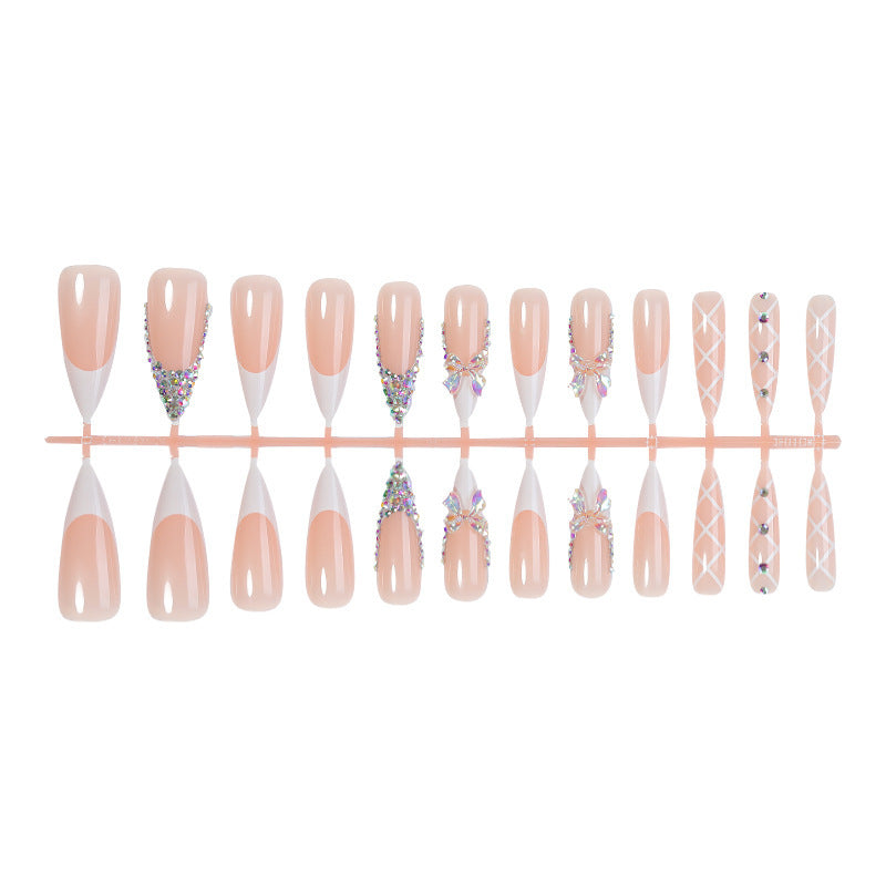 Acrylic nail set with luxurious rhinestone embellishments and bow accents Stornfield