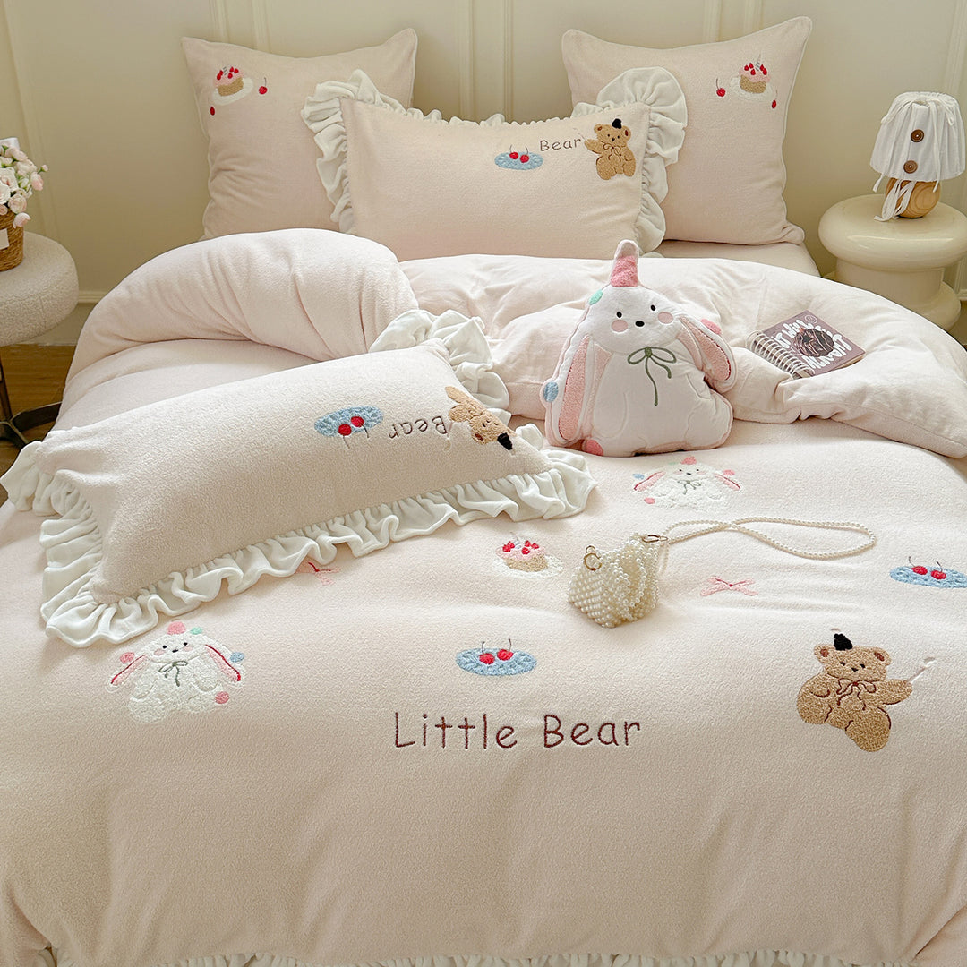 Bedding set with plush surface, ruffled hem and cute embroidery designs