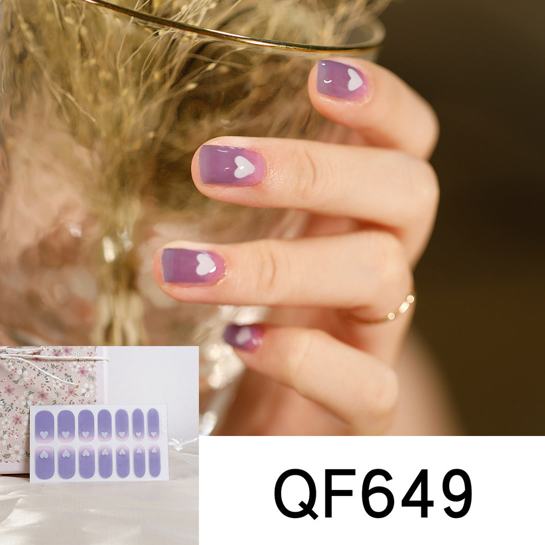 Artificial nail art with heart-shaped designs and soft color gradients Stornfield