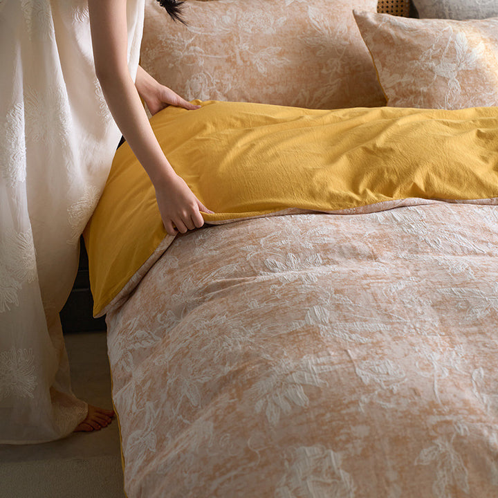 Reversible cotton bedding set with floral toile print and linen look