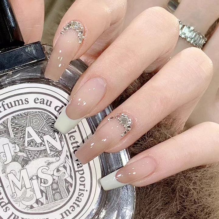 Artful stiletto nails with rhinestone accents Stornfield