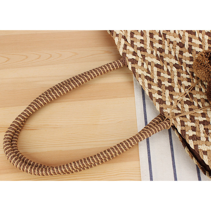 Fashionable basket bag with decorative pompons Stornfield