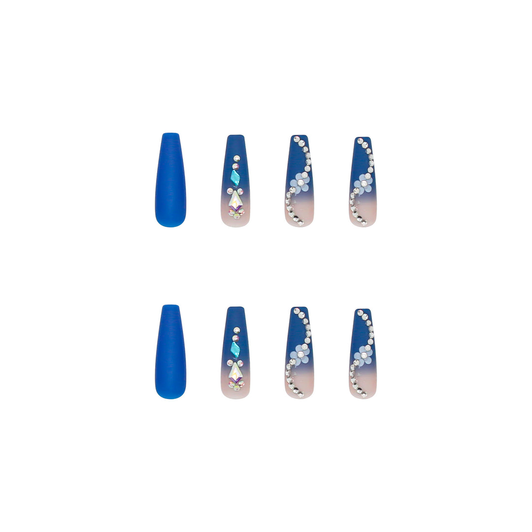 Nail art set with elegant 3D flower designs and glitter accents Stornfield
