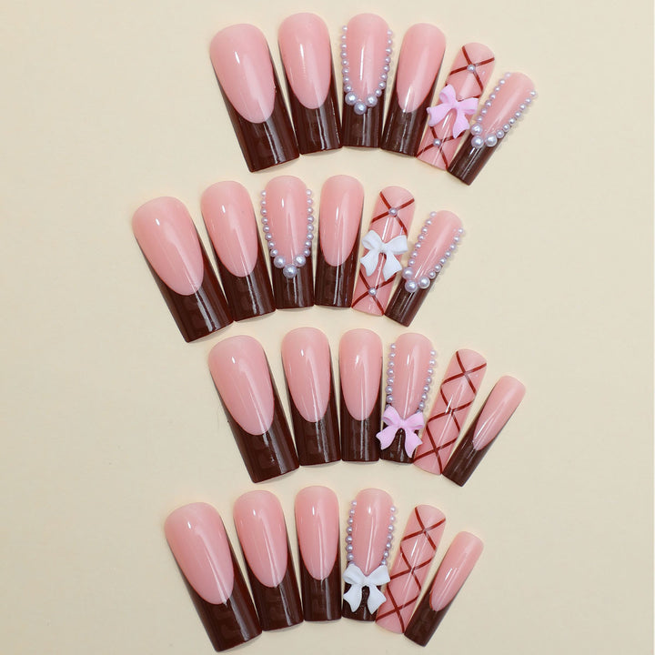 Artificial nail set with stylish 3D bow details and elegant shine Stornfield