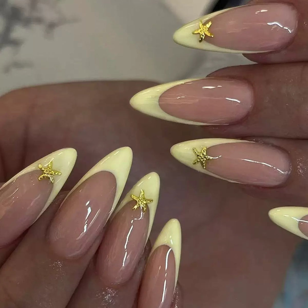 Artificial nail set with elegant tips and gold embellishments Stornfield