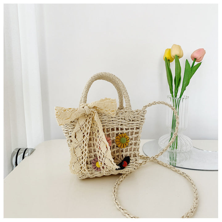 Playful basket bag with floral appliqués Stornfield