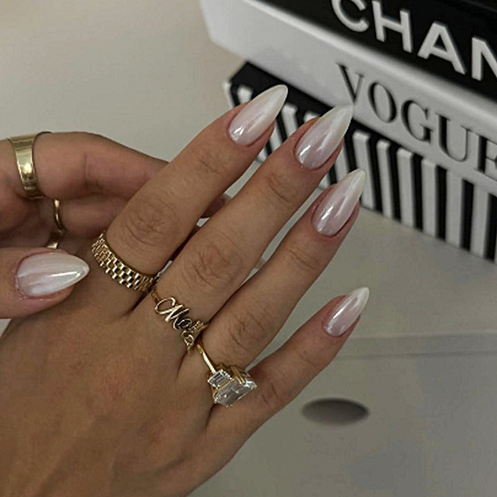 Acrylic nail set with elegant pointed shapes and glossy accents Stornfield