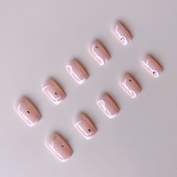 Artificial nail set with elegant French tips and glamorous rhinestone decorations Stornfield