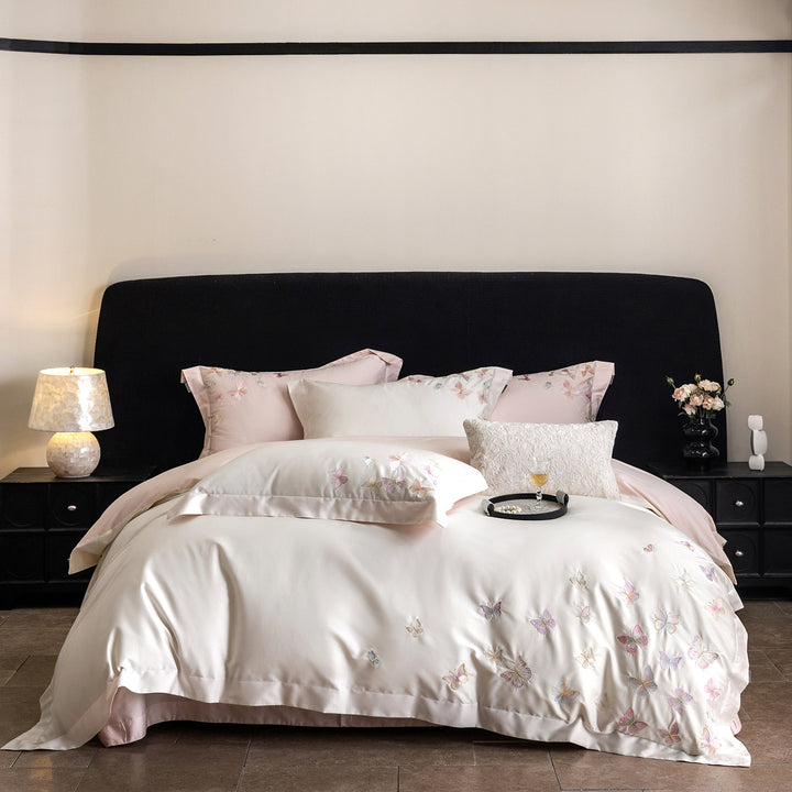 Premium bedding set made of extra soft cotton satin with delicate butterfly embroidery and concealed hotel closure