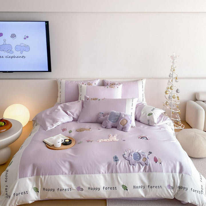 Playful children's bedding set in satin look with 3D elephant appliqués and happy forest print