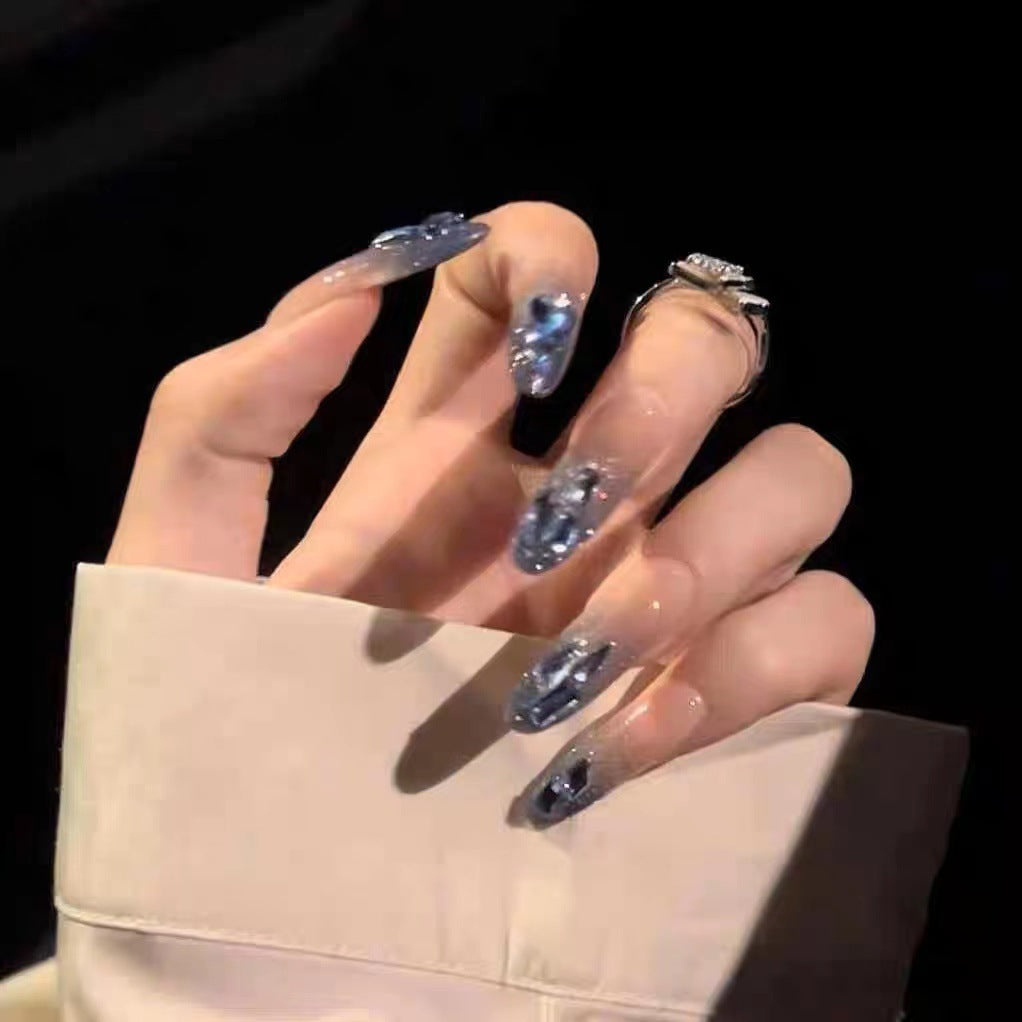 Glamorous artificial nails with delicate flower and glitter effects Stornfield