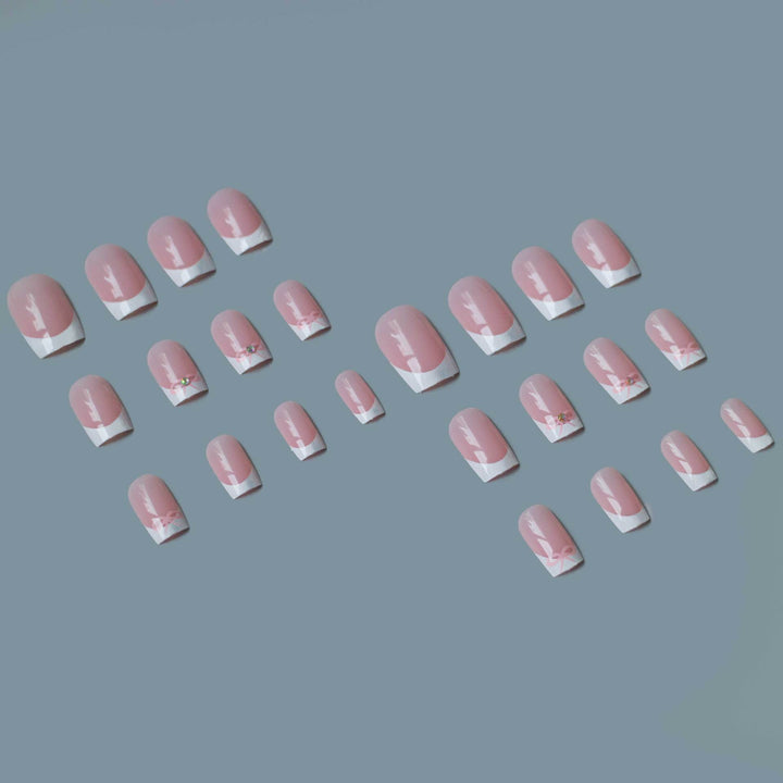 Elegant French Tip Nail Art Set with Delicate Bow Accents
