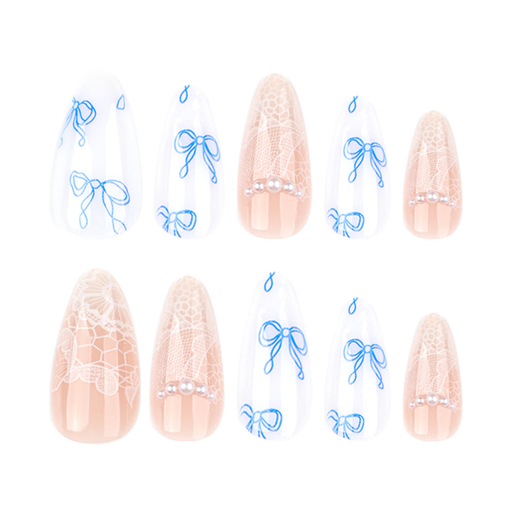 Artistic stiletto nails with delicate bow decorations Stornfield