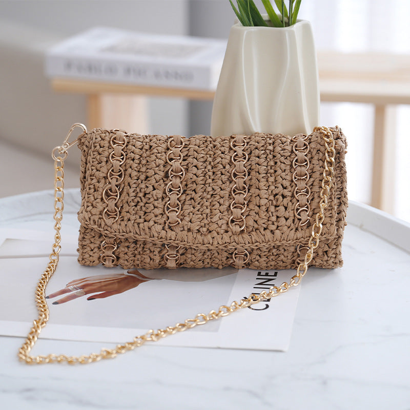 Clutch with chain shoulder strap and handcrafted macrame closure Stornfield