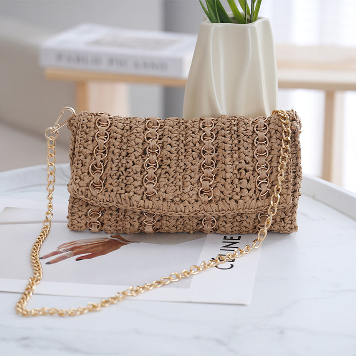 Clutch with chain shoulder strap and handcrafted macrame closure Stornfield