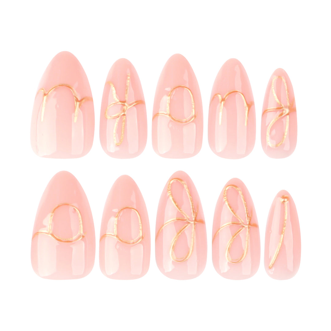 Creative nail art with golden accents and trendy lettering Stornfield