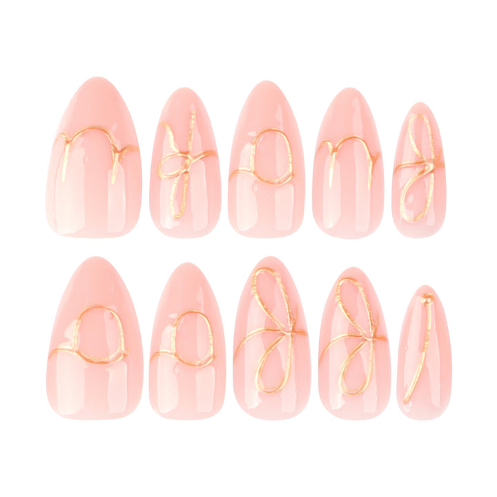 Creative nail art with golden accents and trendy lettering Stornfield