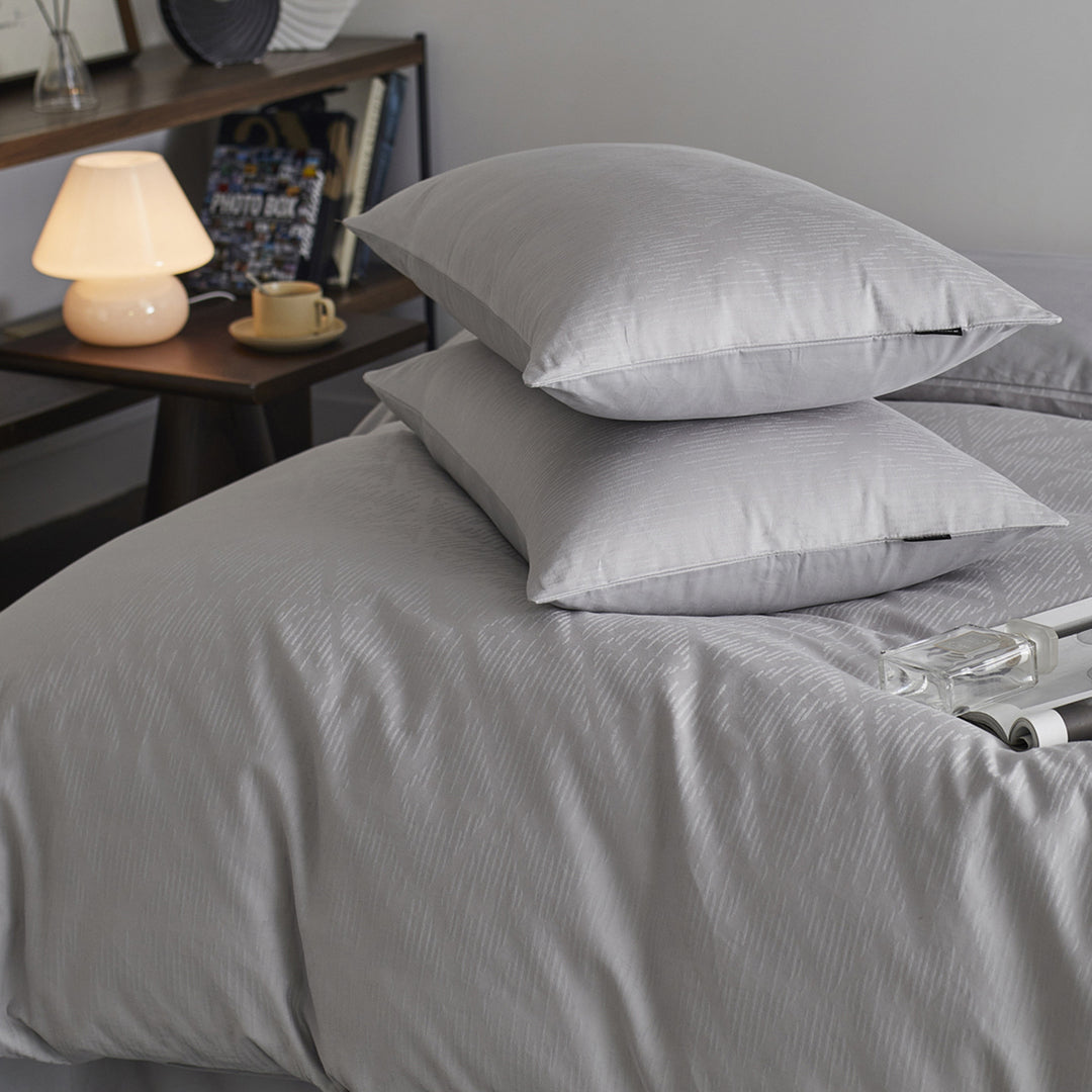 Reversible cotton percale bedding set with fine relief texture and additional pillowcases