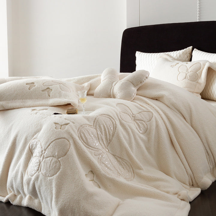 Cozy bedding and throw blanket set with applied butterfly appliqués and velvety microfleece look