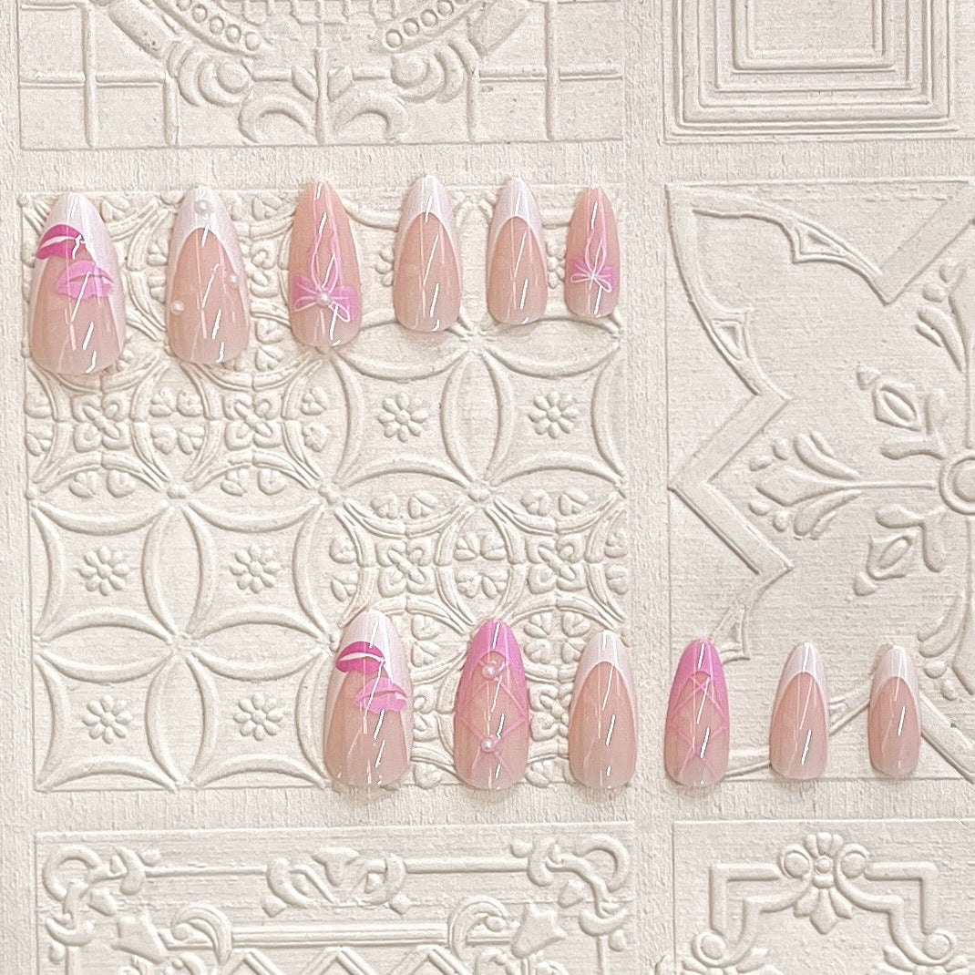 Artistic Press-On Nail Set with Kiss and Bow Design Stornfield