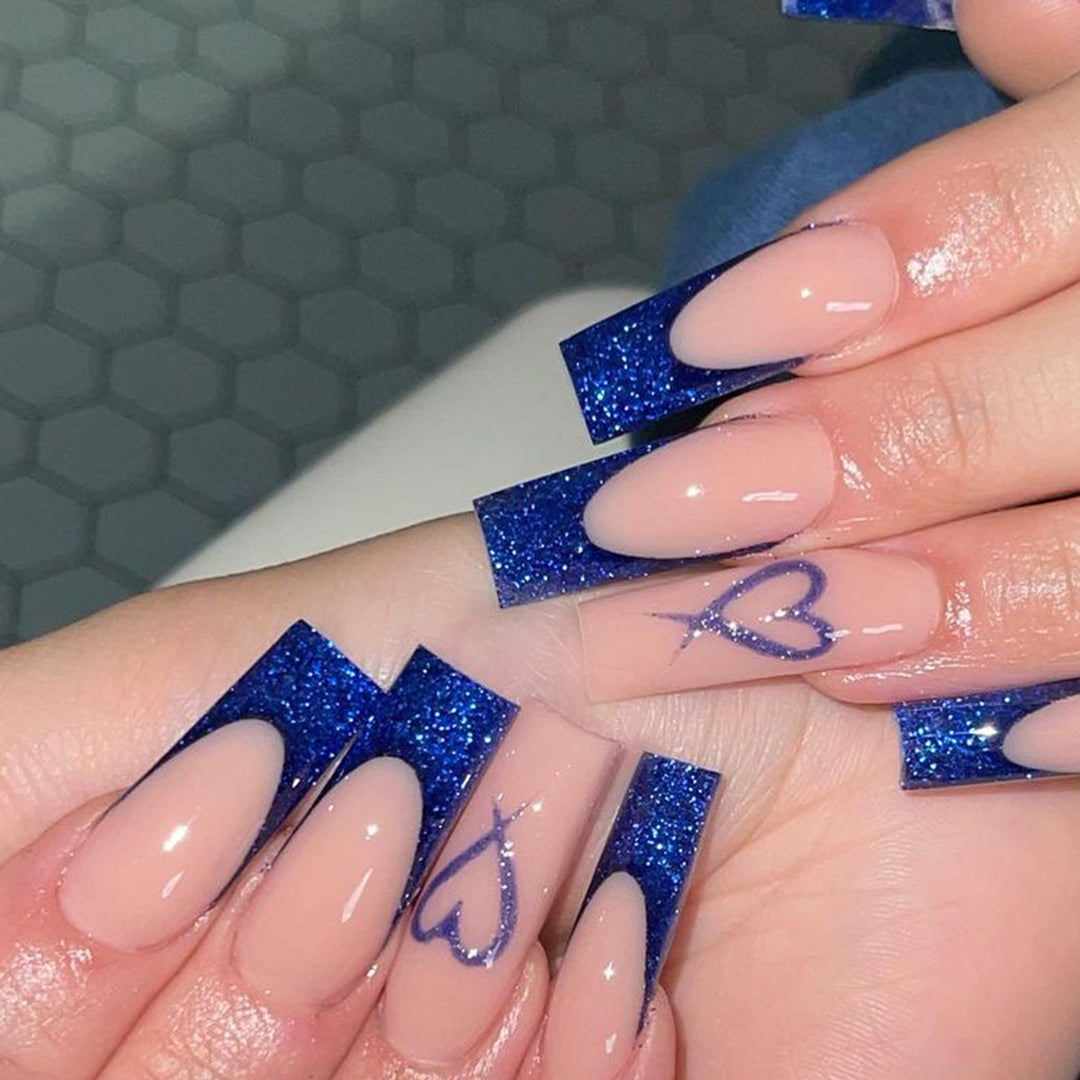 Artificial nails with glitter accents and unique heart design Stornfield