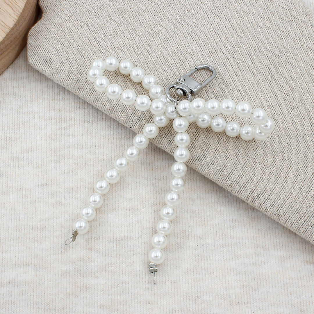 Elegant Pearl Bow Keychain Stornfield