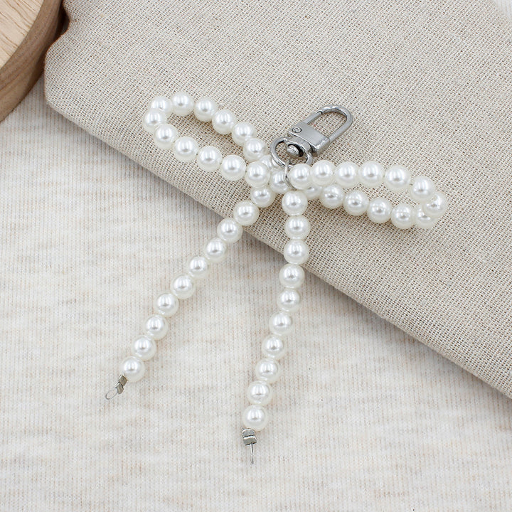 Elegant Pearl Bow Keychain Stornfield