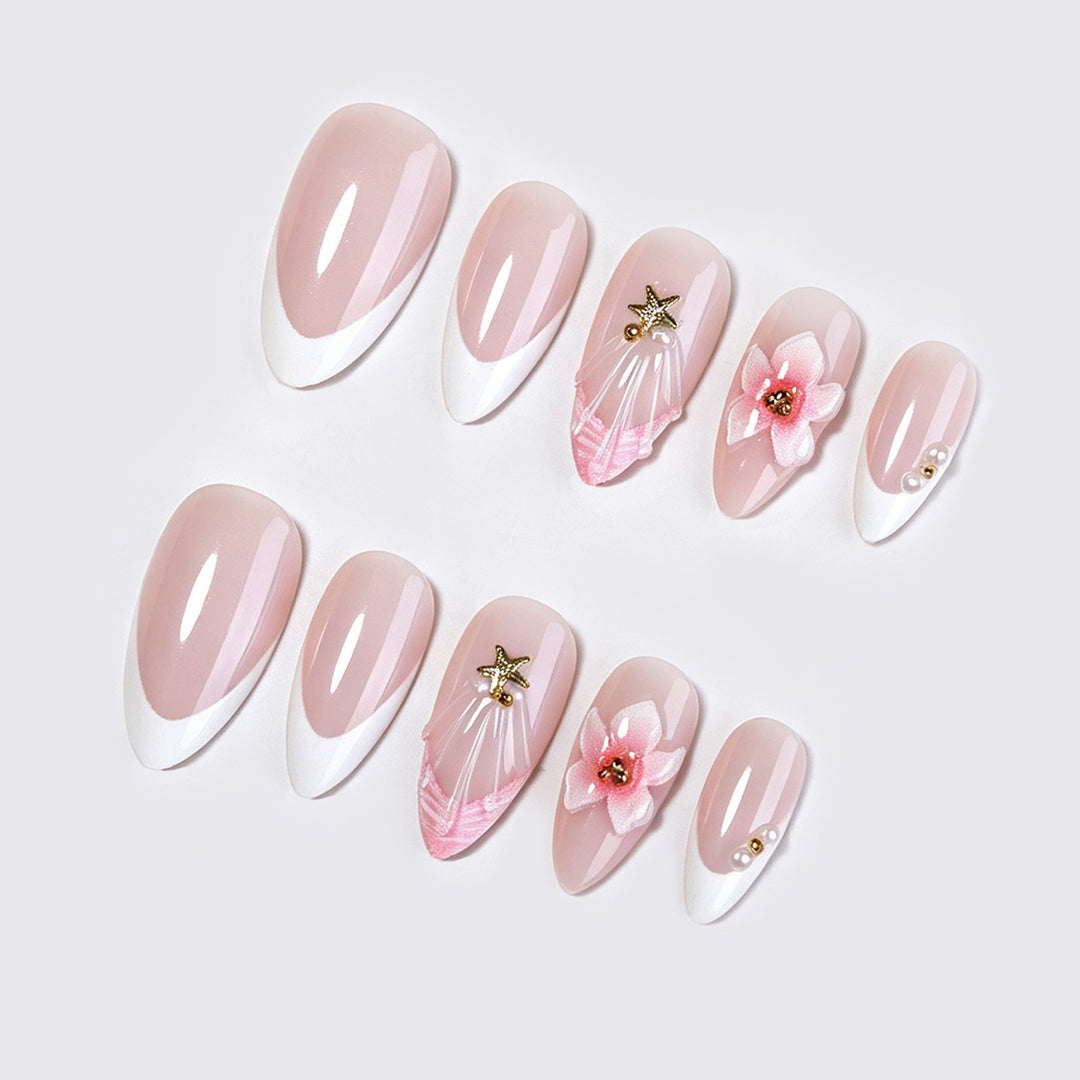 Artificial nail set with delicate flower and glitter applications Stornfield