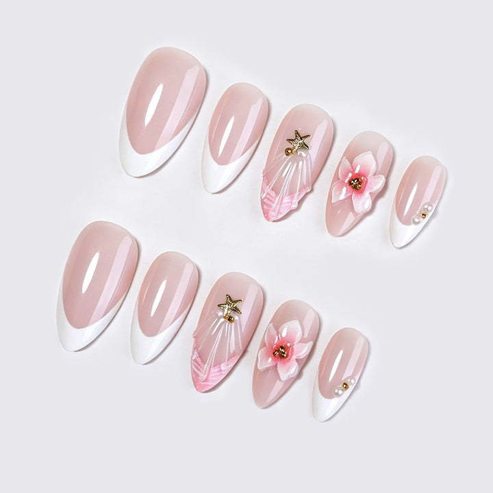 Artificial nail set with delicate flower and glitter applications Stornfield
