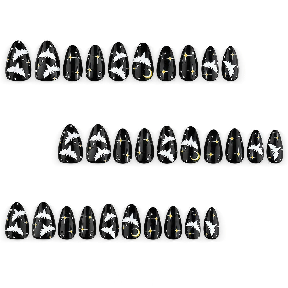 Artificial nails in creative Halloween bat design Stornfield