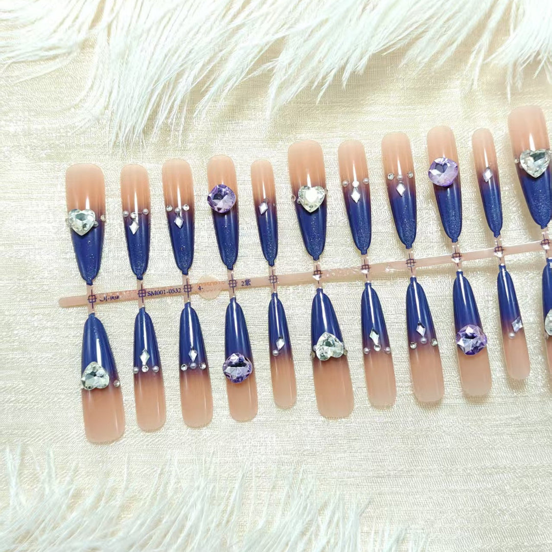 Artificial nails with elegant glitter design and 3D rhinestone accents Stornfield