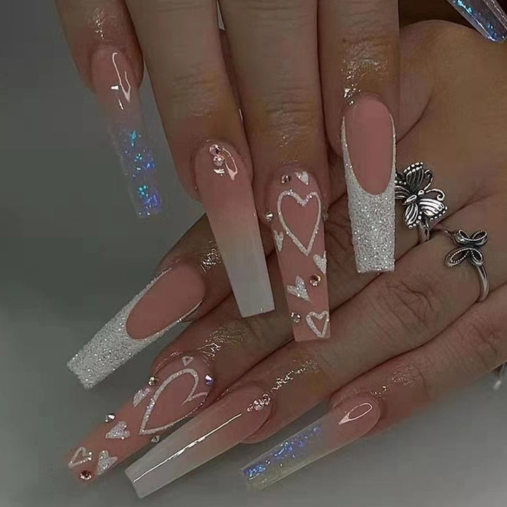 Elegant artificial nail tips with heart and glitter pattern Stornfield