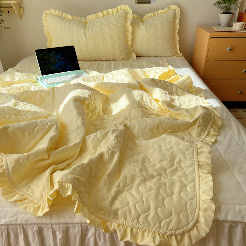 Quilted bedspread set with frill edge and heart quilting pattern