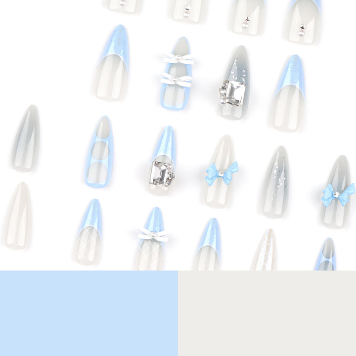 Artistic stiletto nails with elegant jewelry accents Stornfield