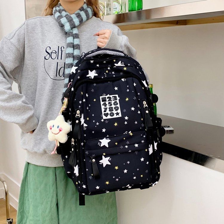 Playful backpack with star motifs and practical functions Stornfield